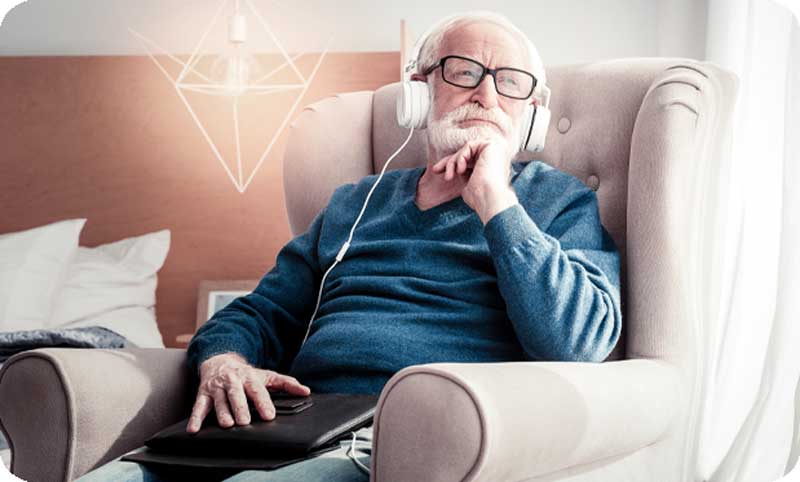 Older man listening to music